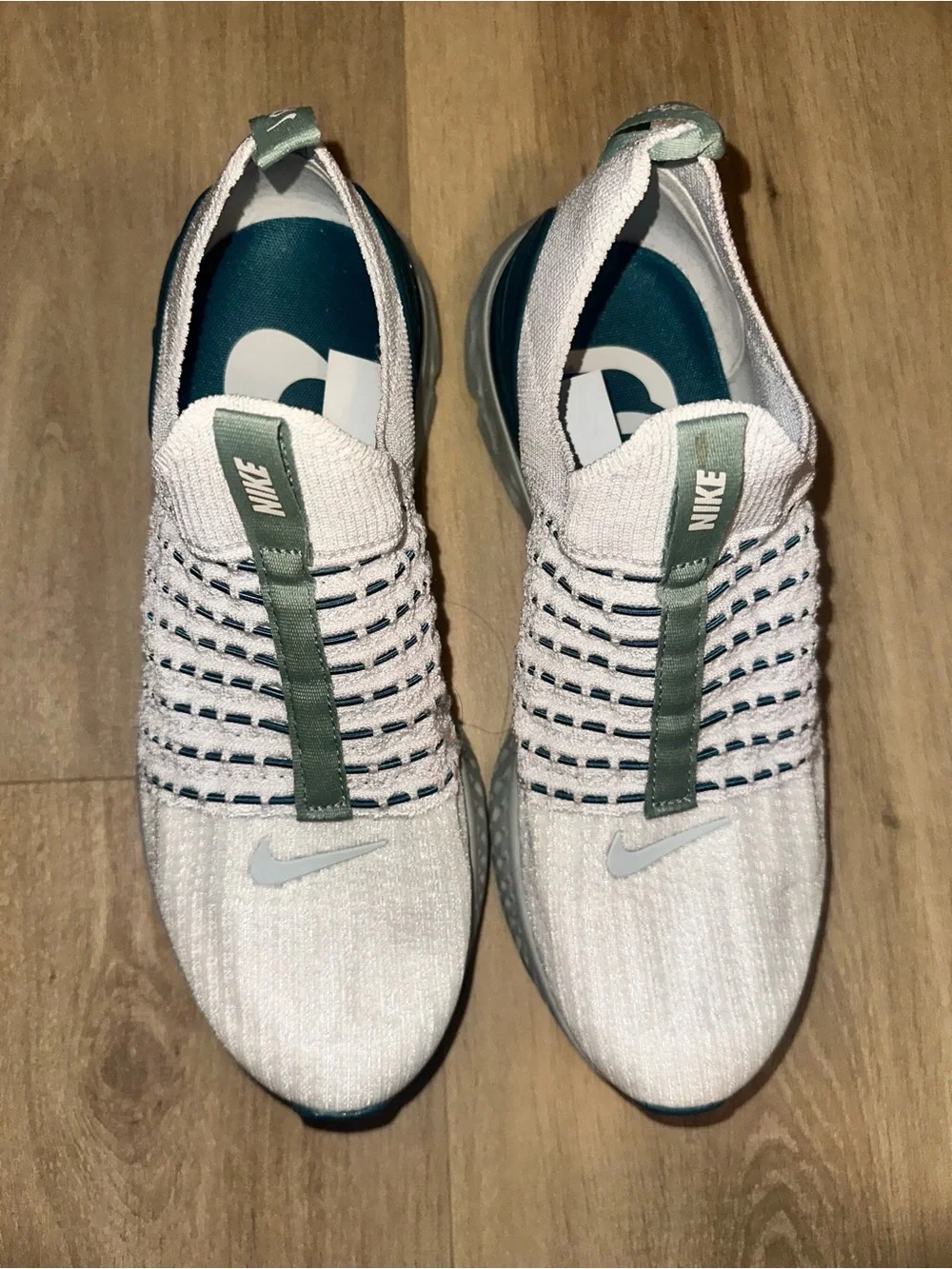 Nike Women’s White Knit Slip-On Sneakers with Teal and Gray Accents